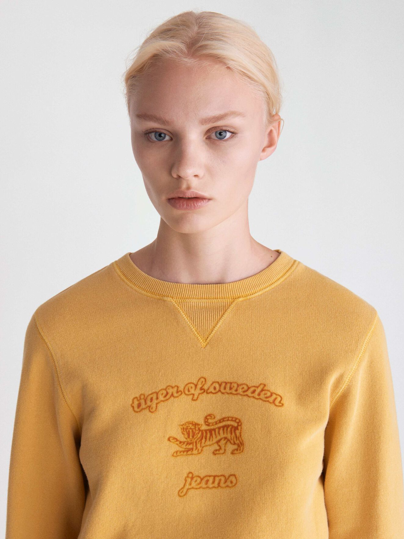 Obscura Pr Sweatshirt in Mustard from Tiger of Sweden Obscura Pr Sweatshirt in Mustard from Tiger of Sweden