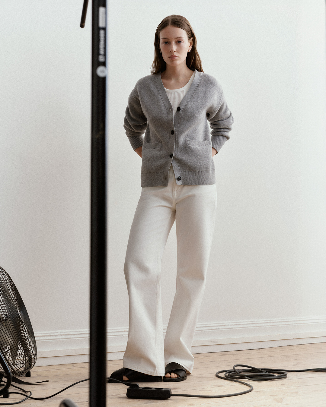 woman in white denim and cardigan