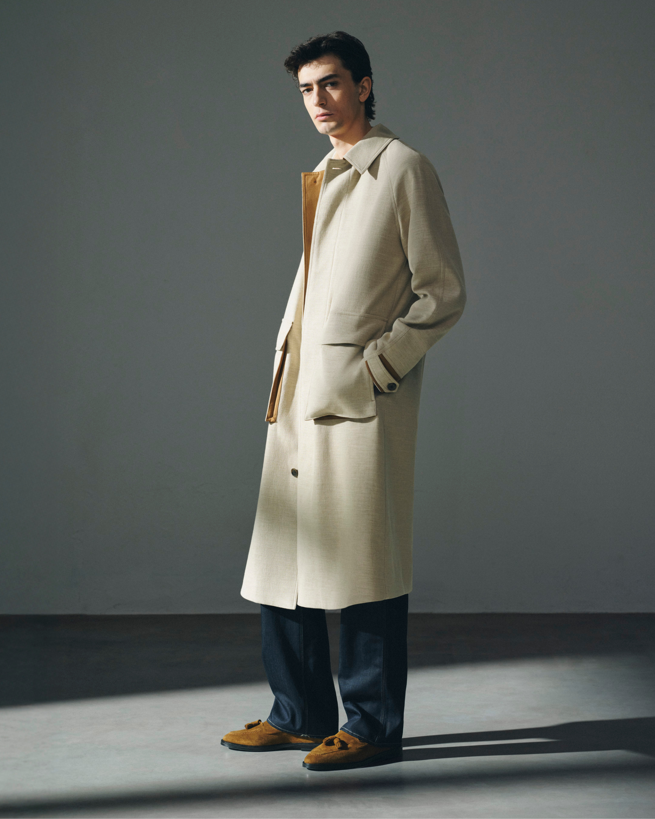 man in beige long trench coat