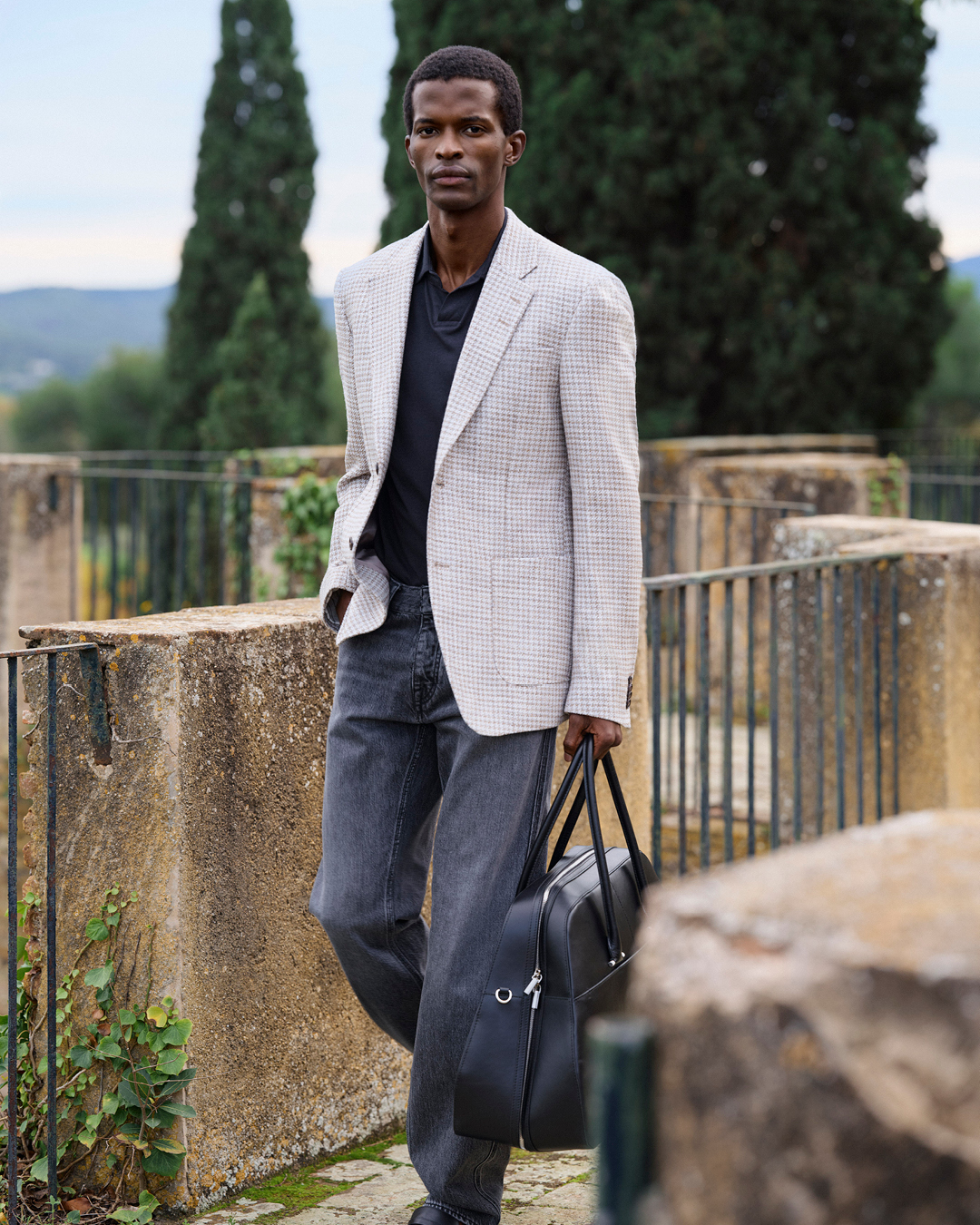Guy in jeans and beige blazer