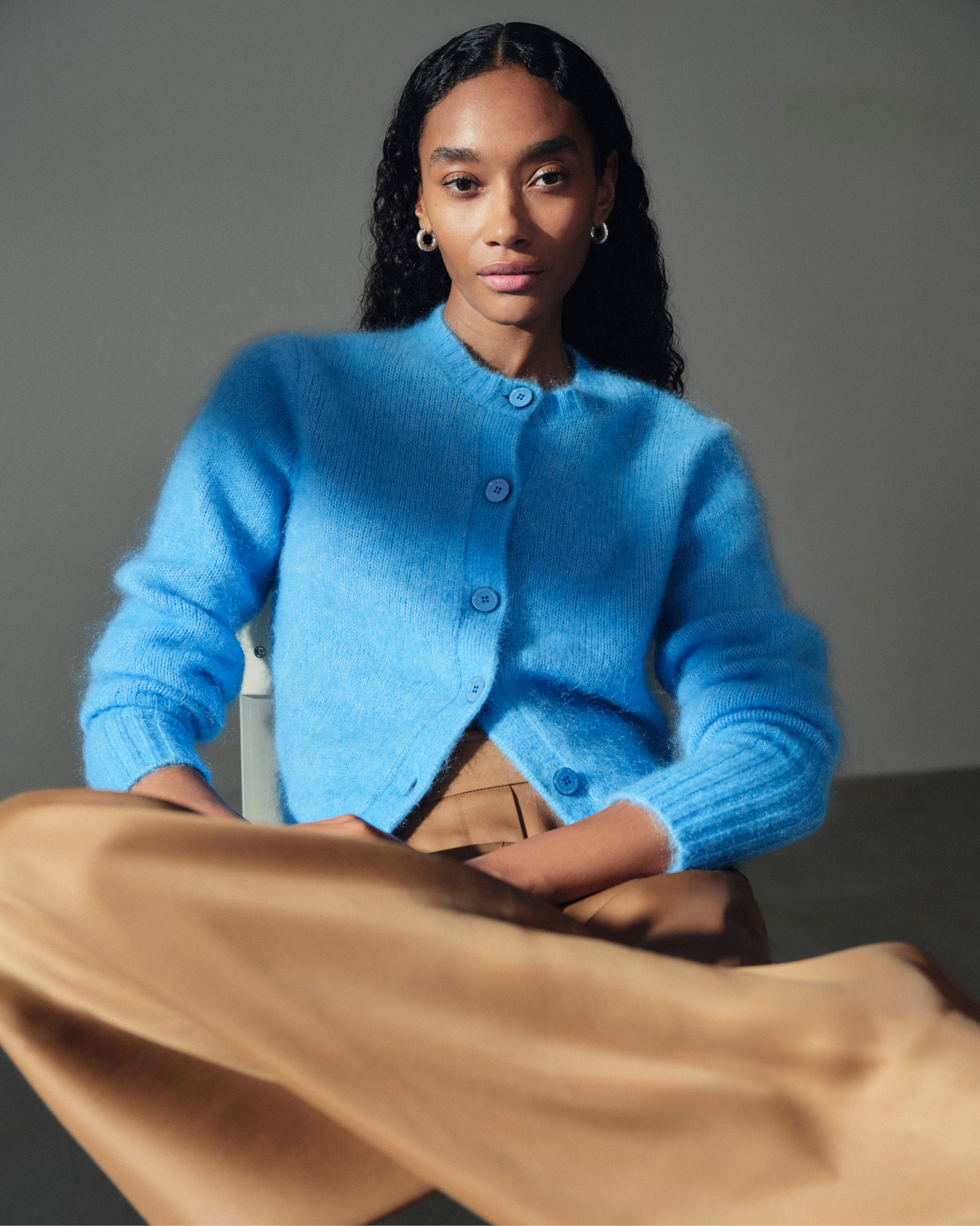woman in bright blue cardigan