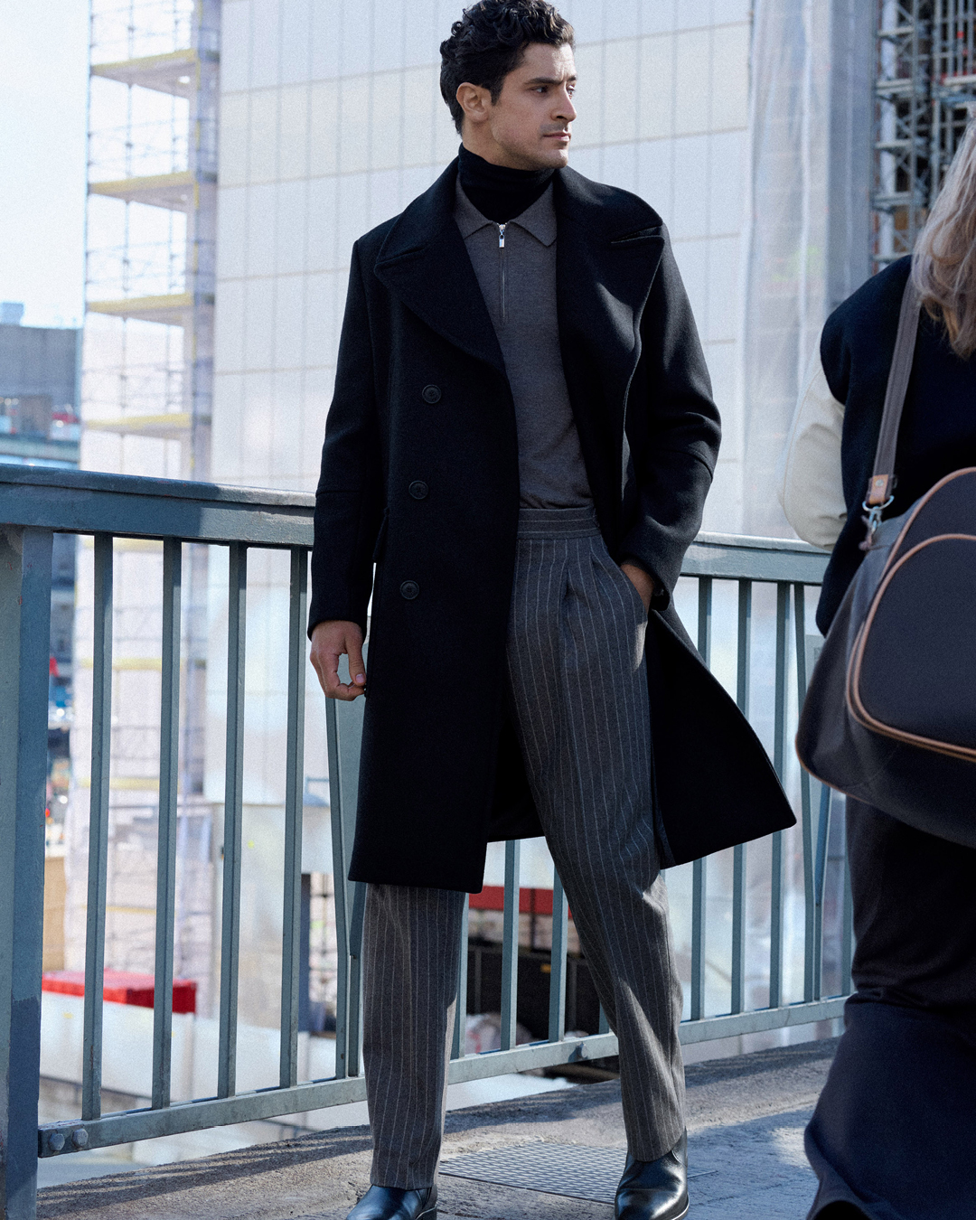 pinstriped trousers and wool coat
