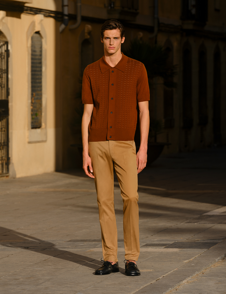 Man in beige chinos and light knit