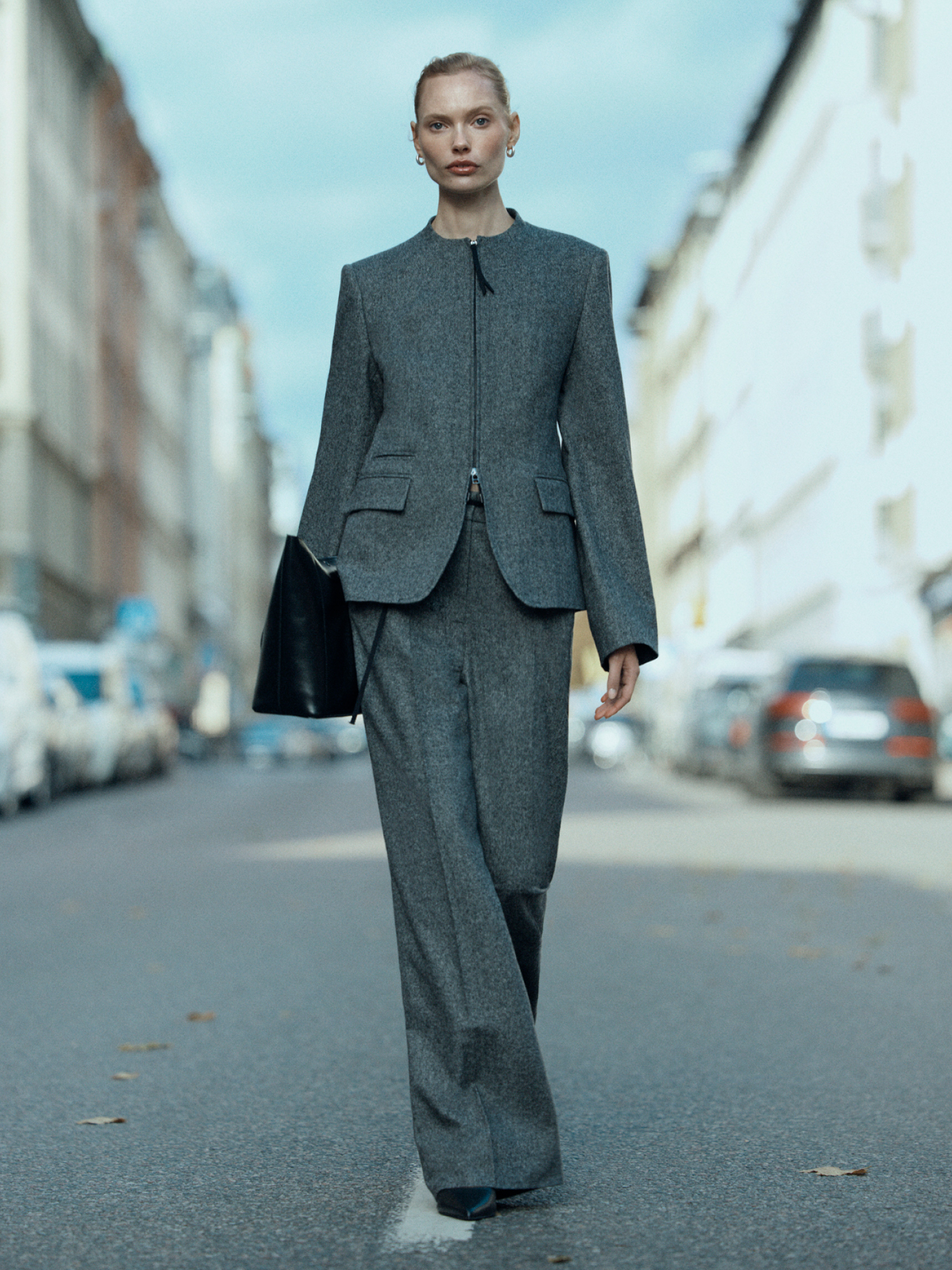 Woman in dark beige suit set