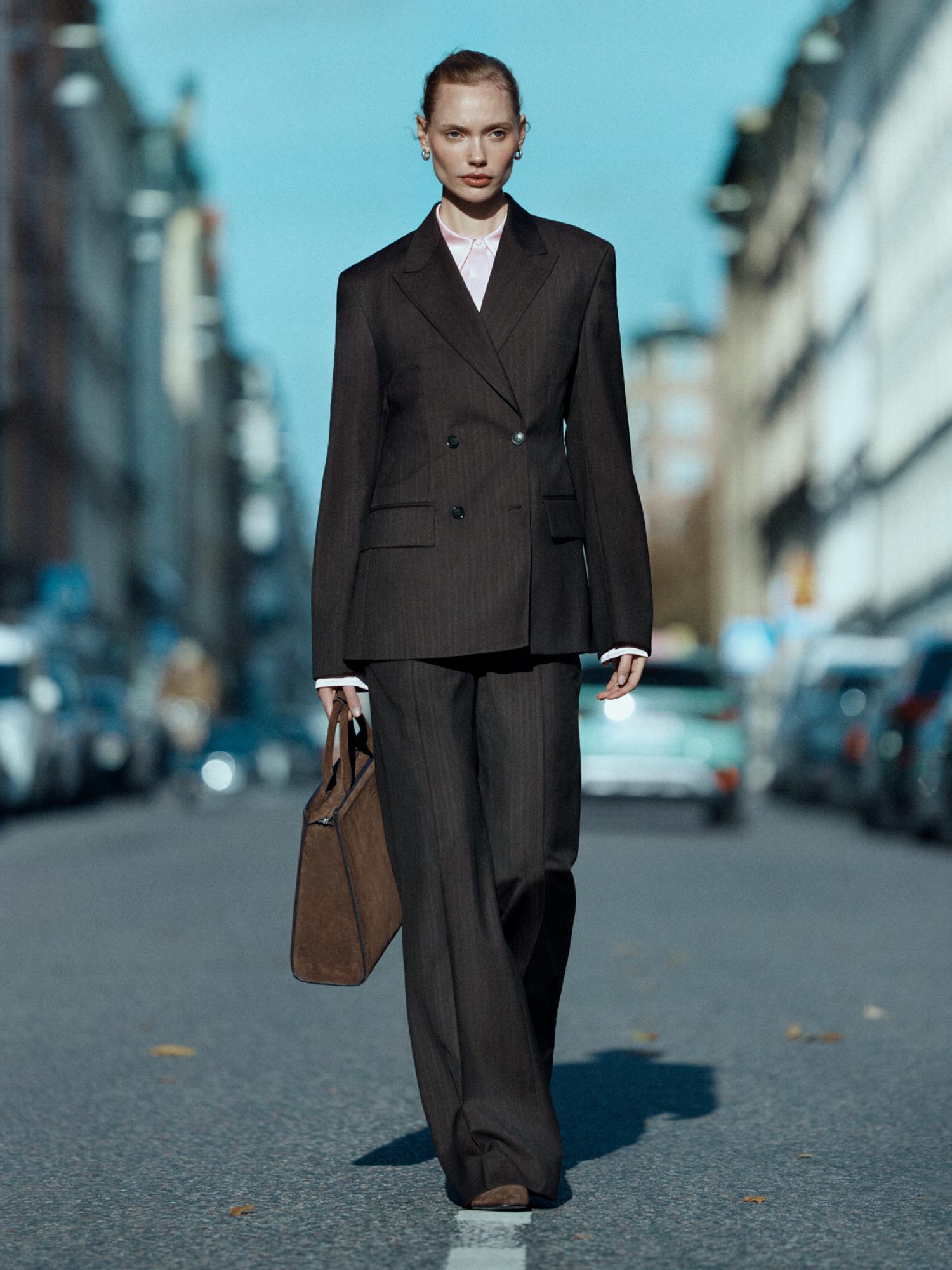 Woman in dark purple suit