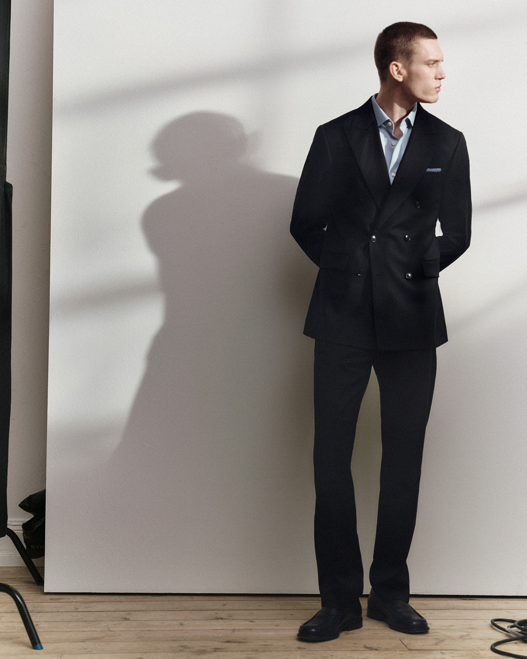 man in black double breasted suit