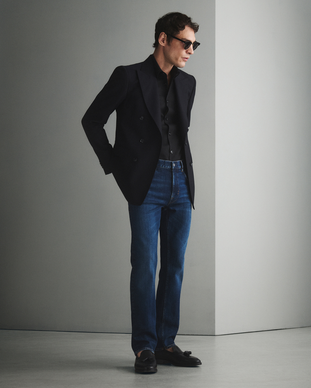 Man in dark denim and blazer