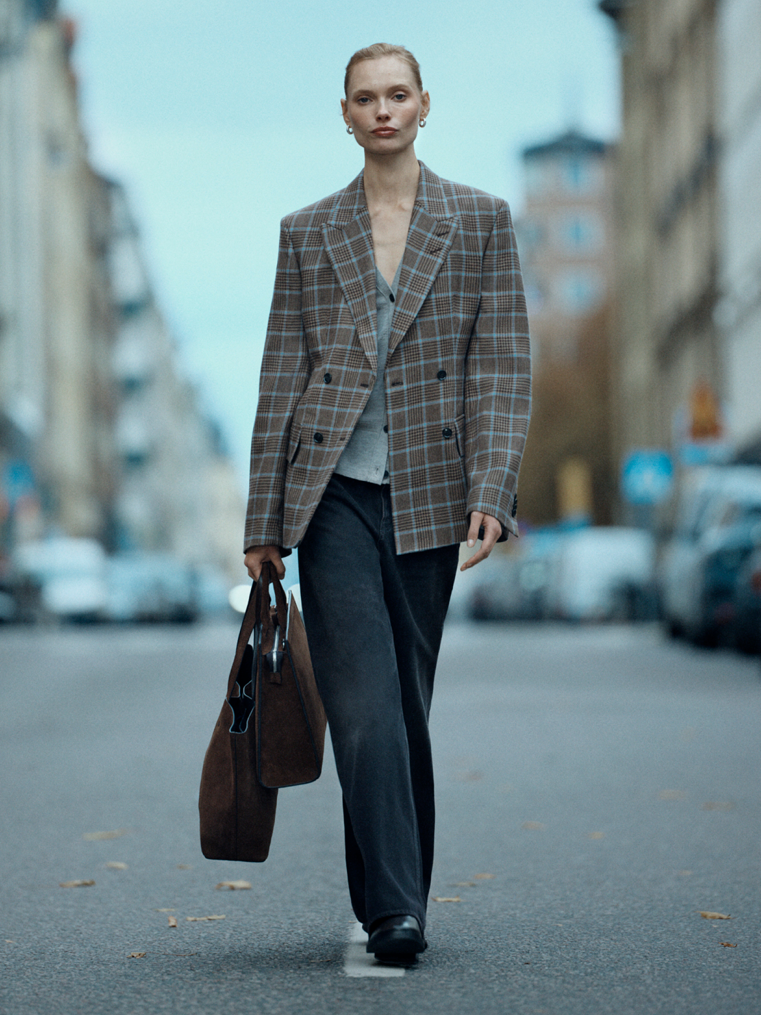 Woman in checkered blazer