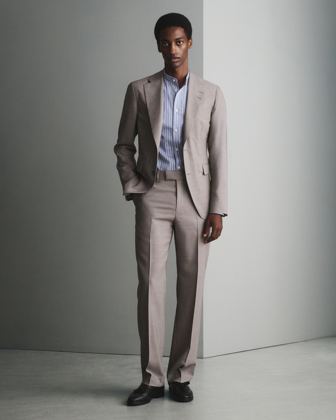 Man in light brown suit