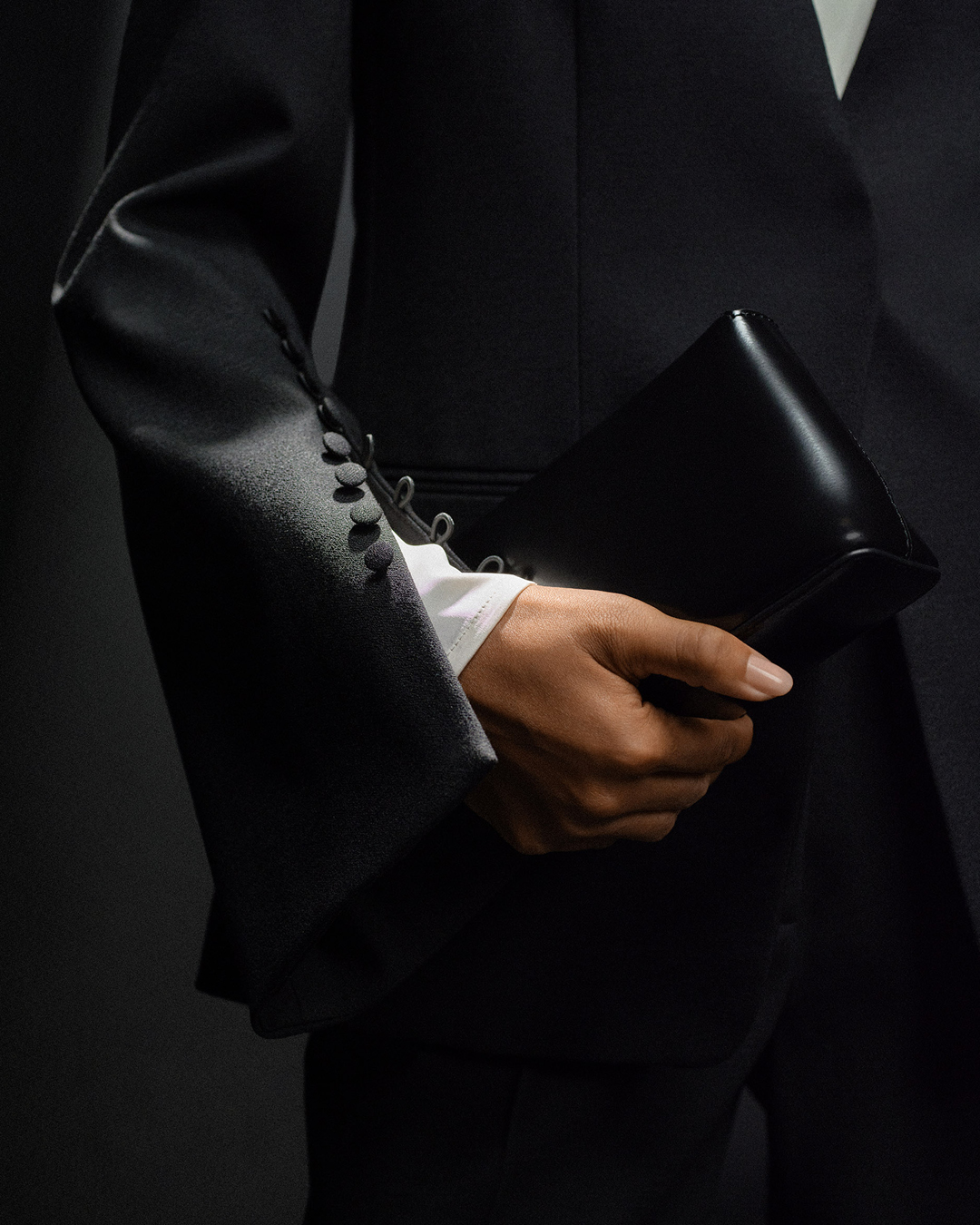 black blazer and festive clutch
