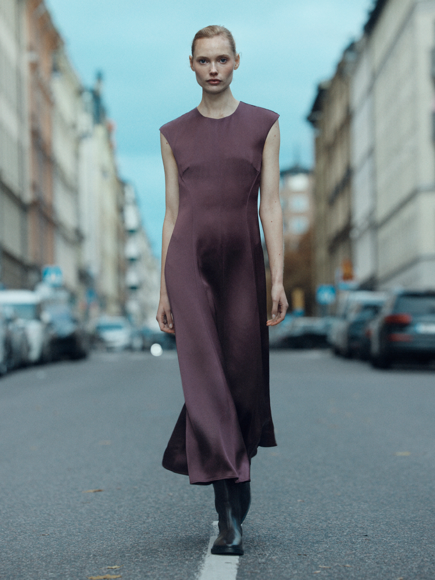 Woman in dark purple dress