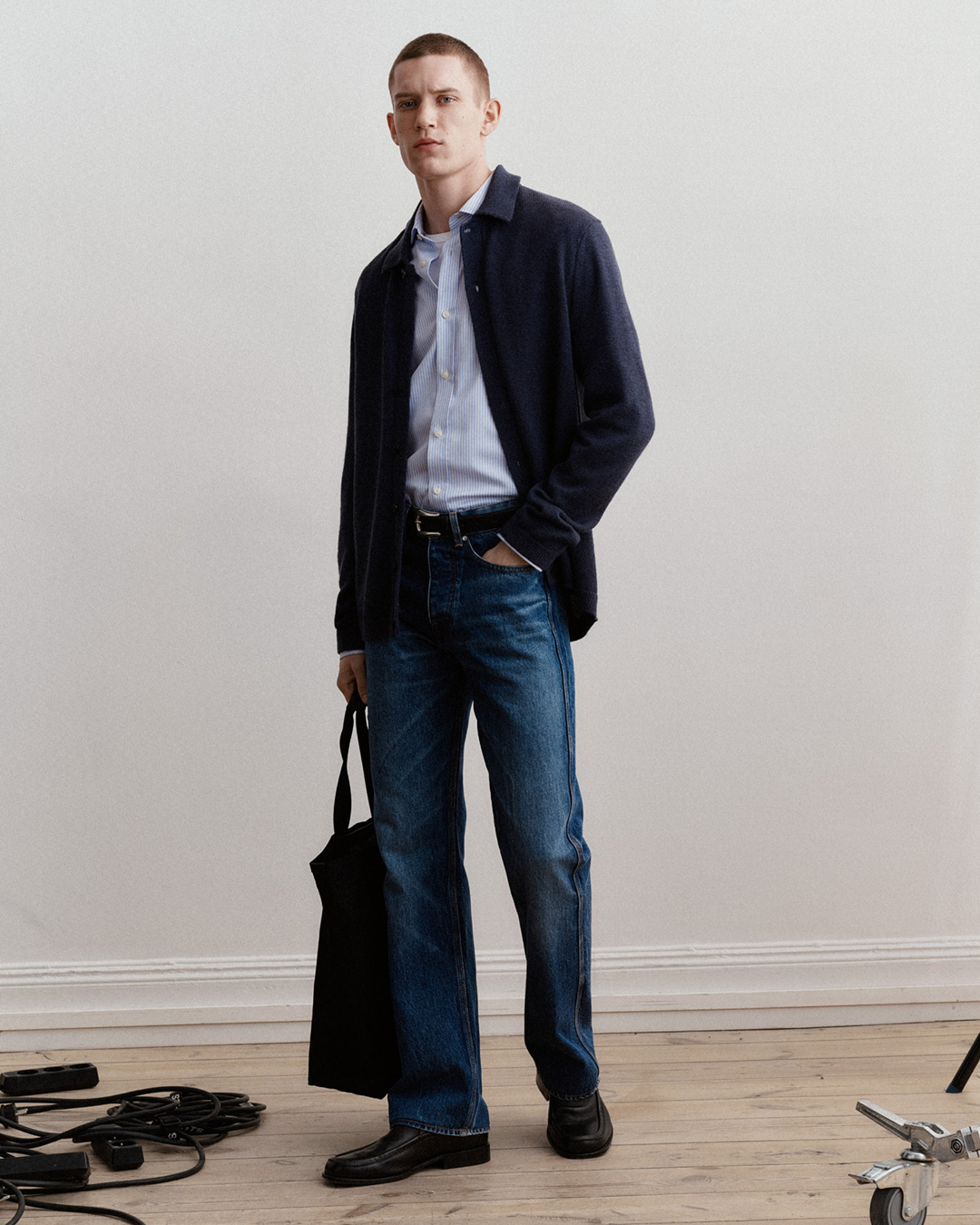 man in blue denim and cardigan