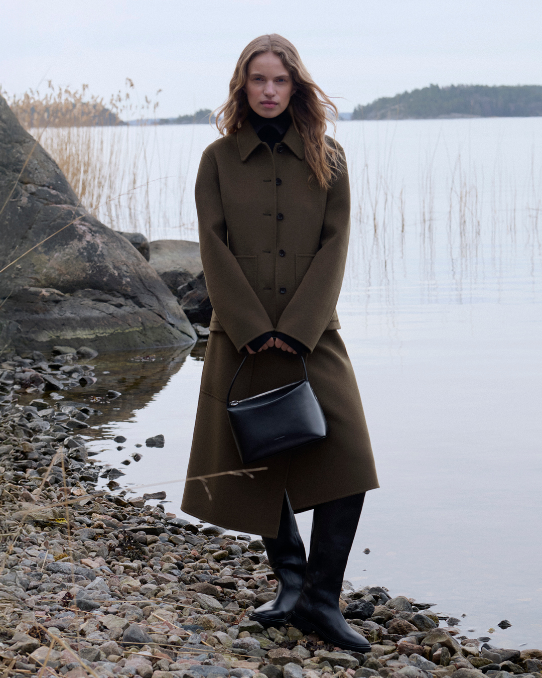 woman in green long coat