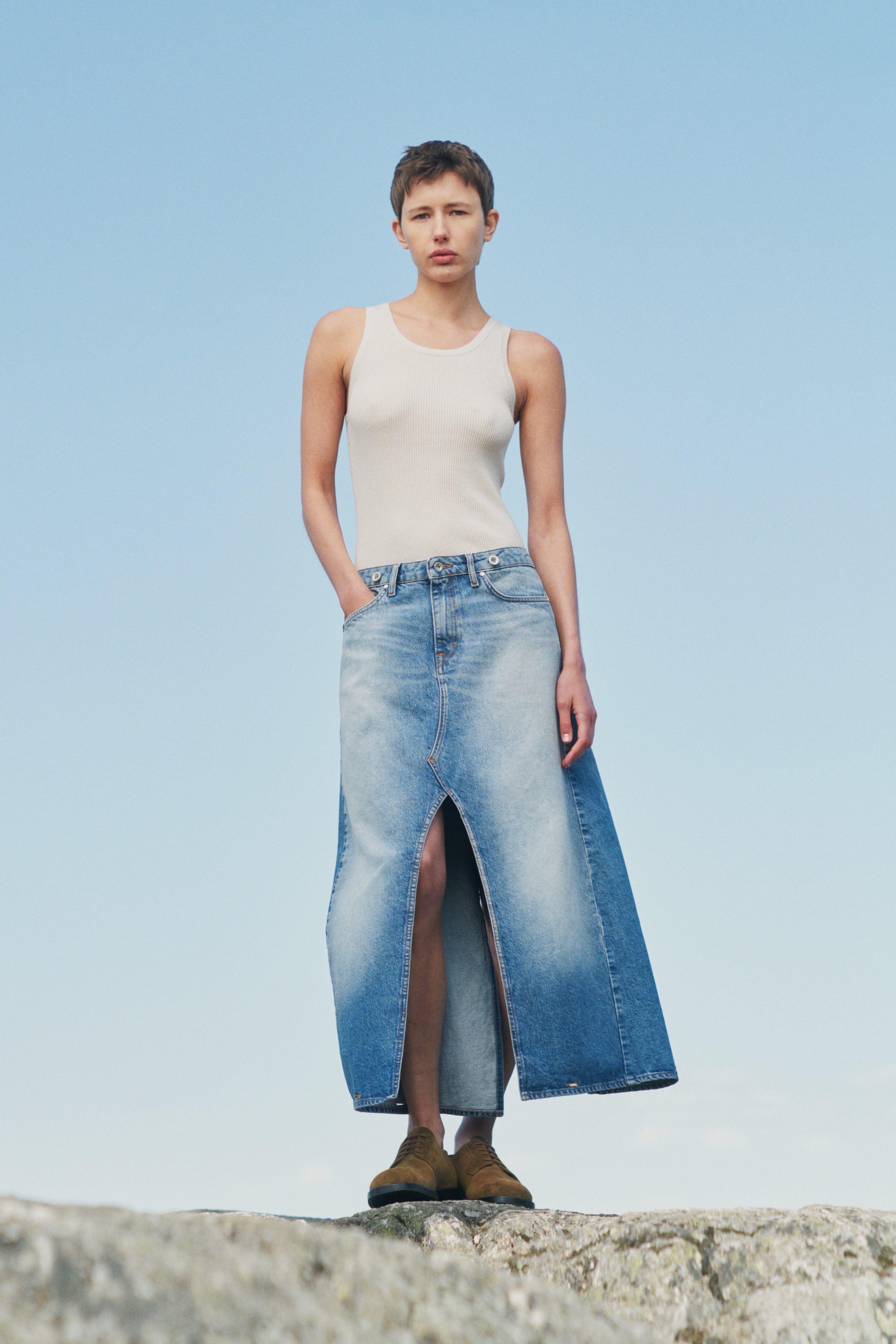 Women in Tiger of Sweden denim skirt and top