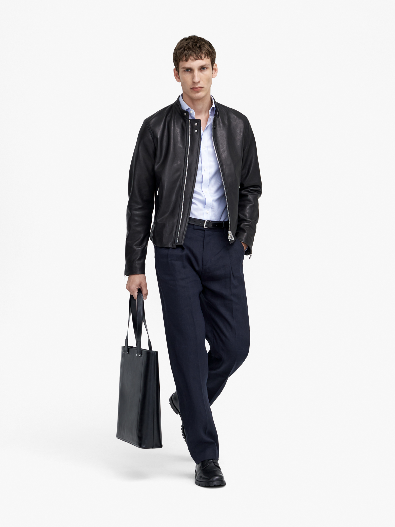 Man in leather jacket with black trousers