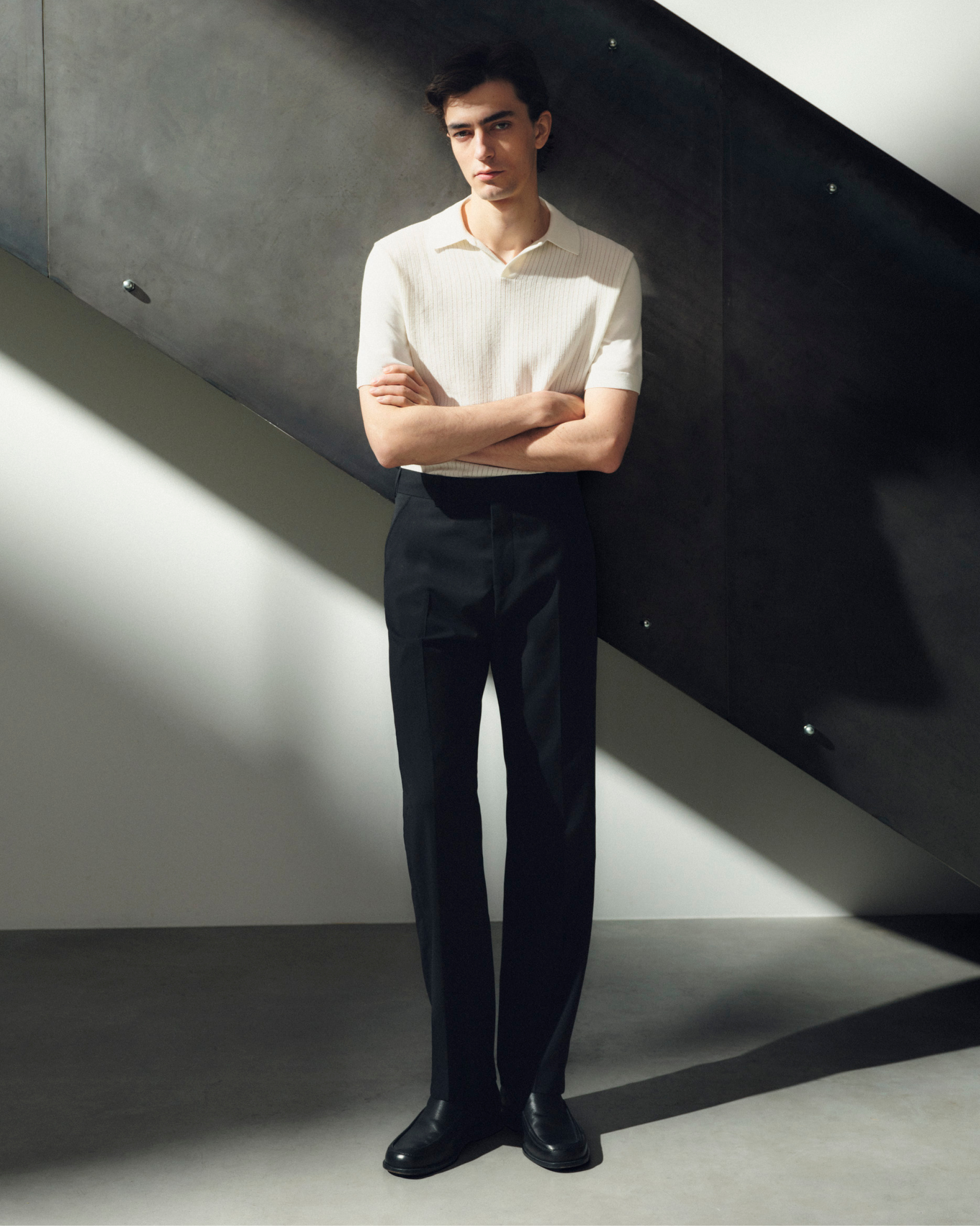 man in black pants & white tshirt