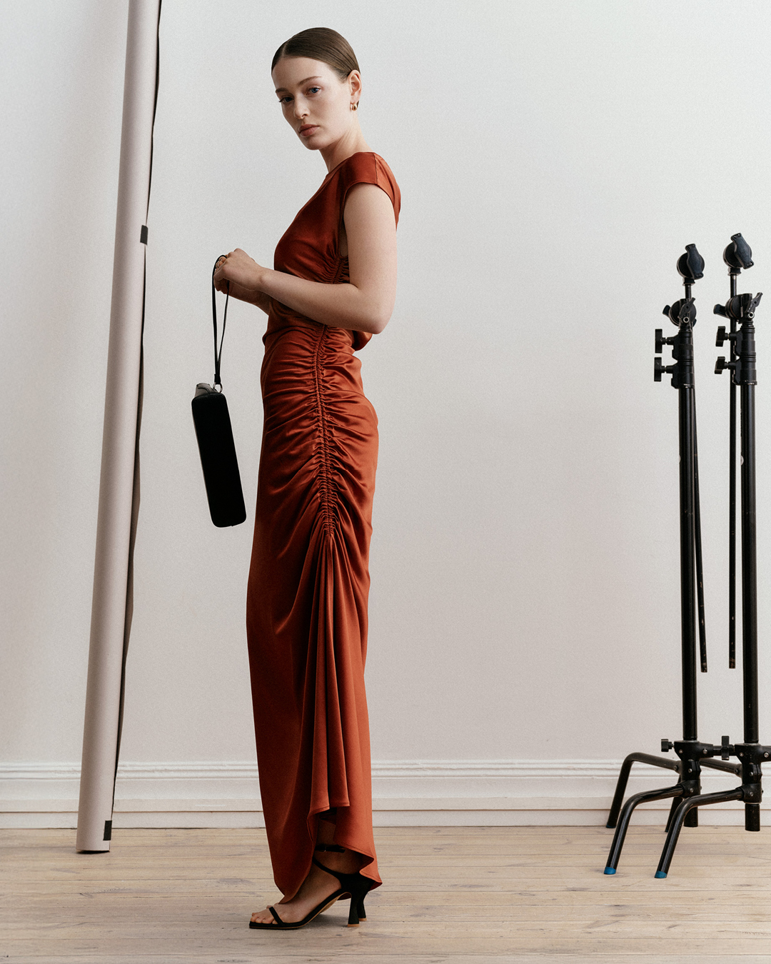 woman in long dark orange dress