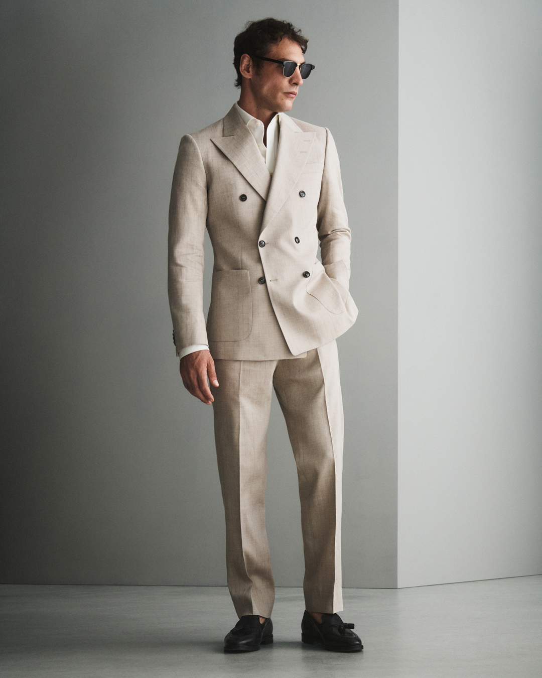 Man in beige double breasted suit
