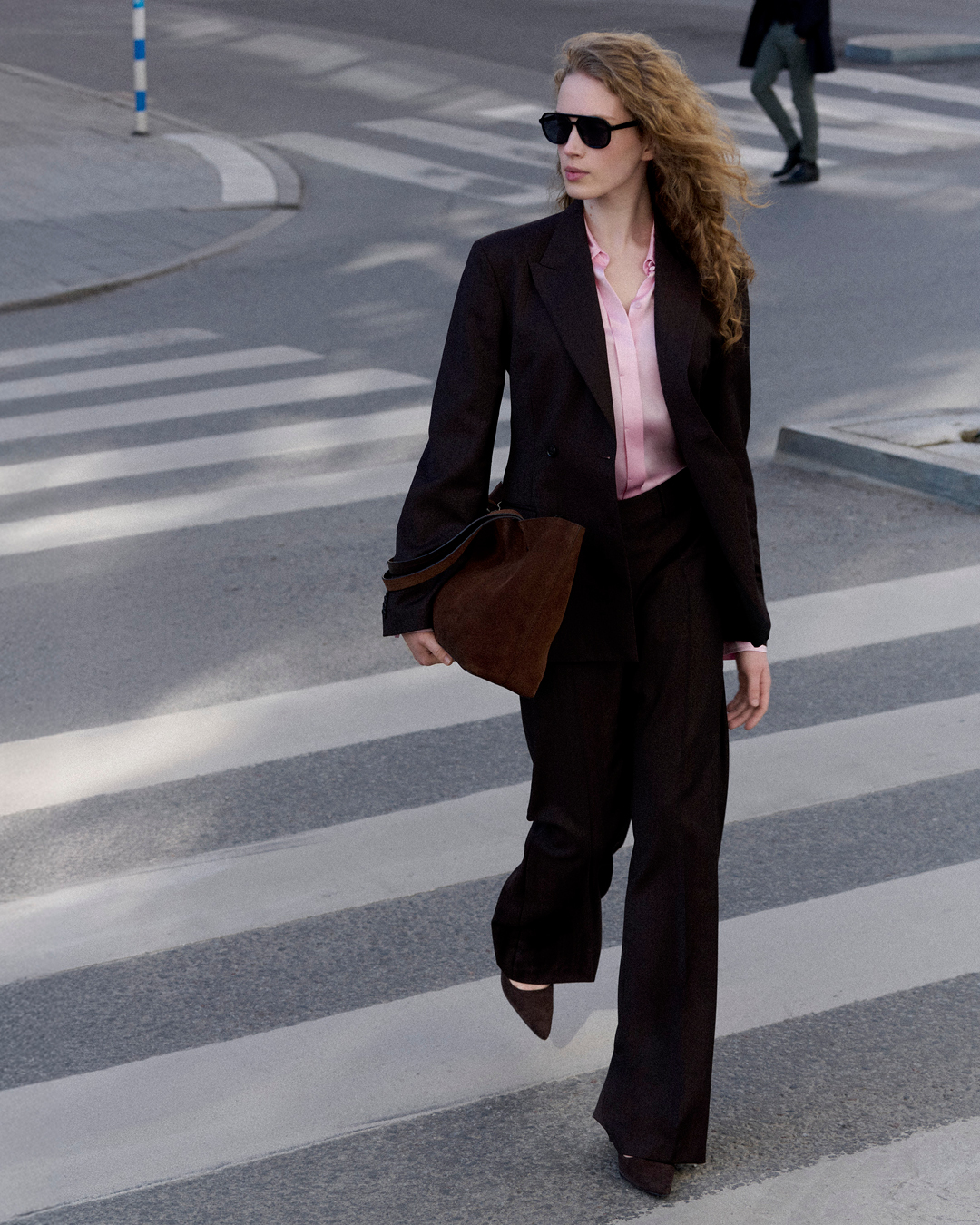 woman in suit and pink blouse