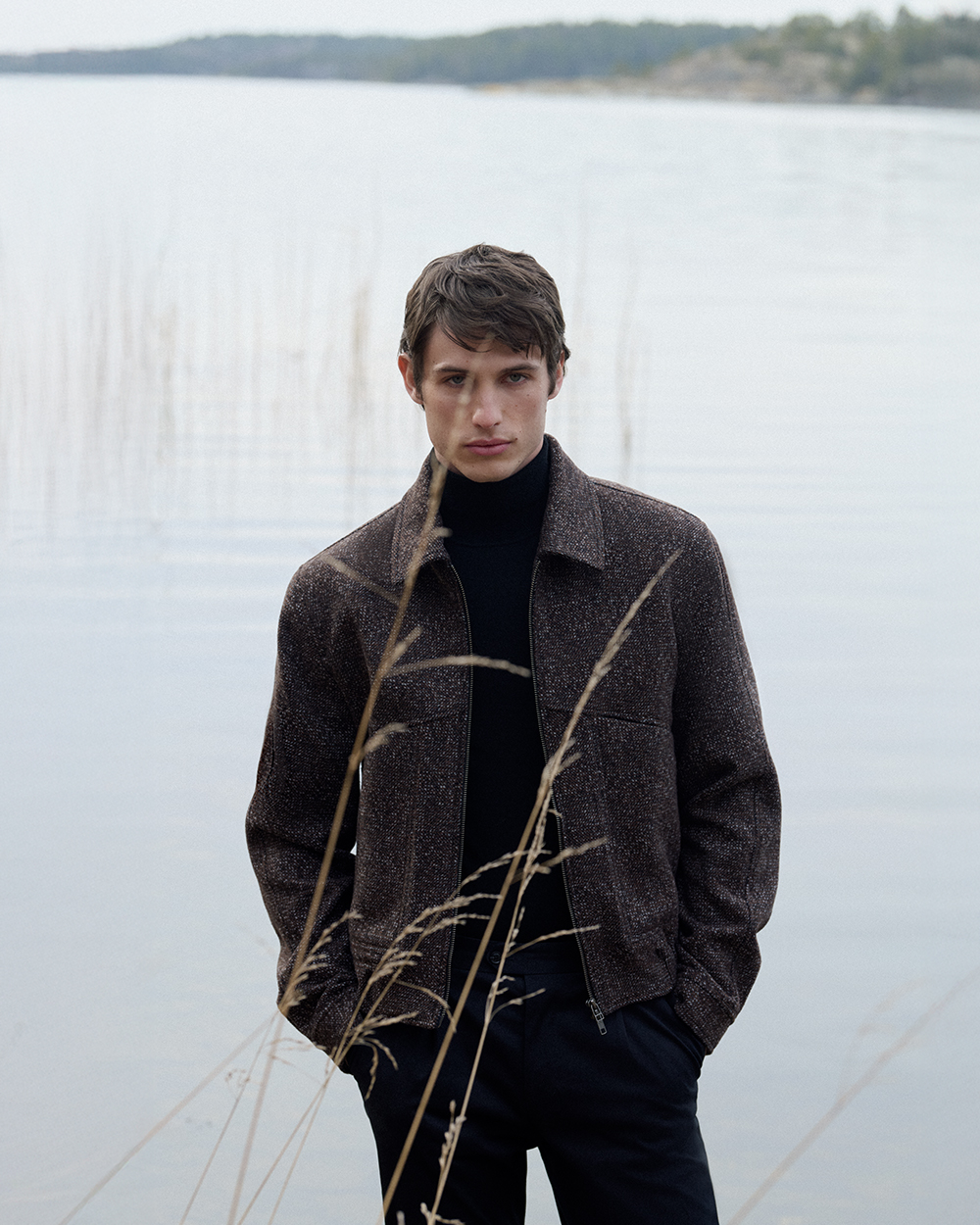 man in brown blouson jacket