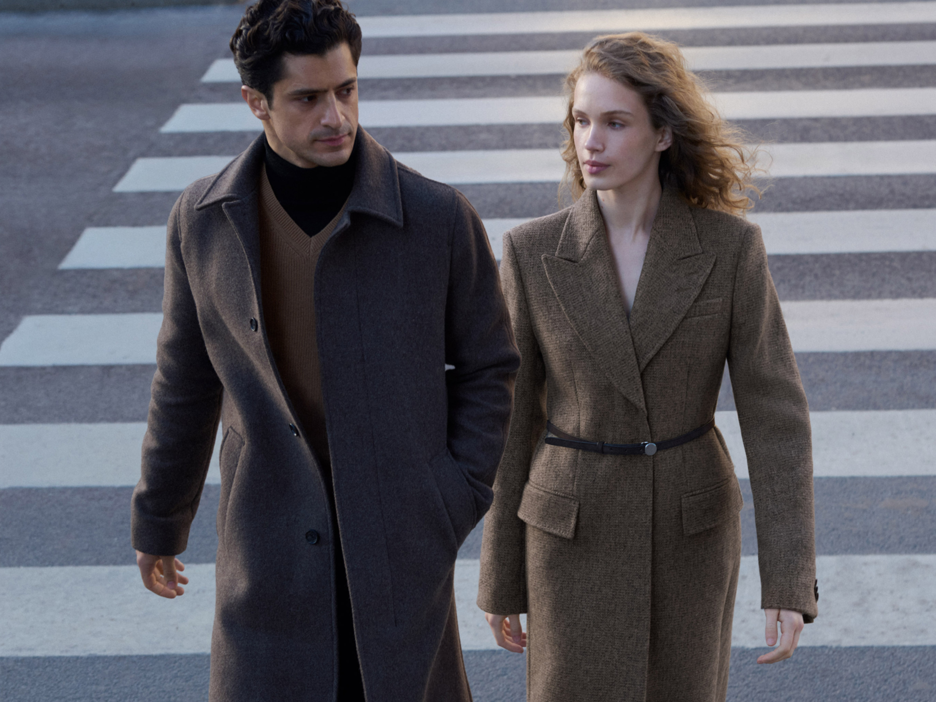 Man and woman in long wool coats 