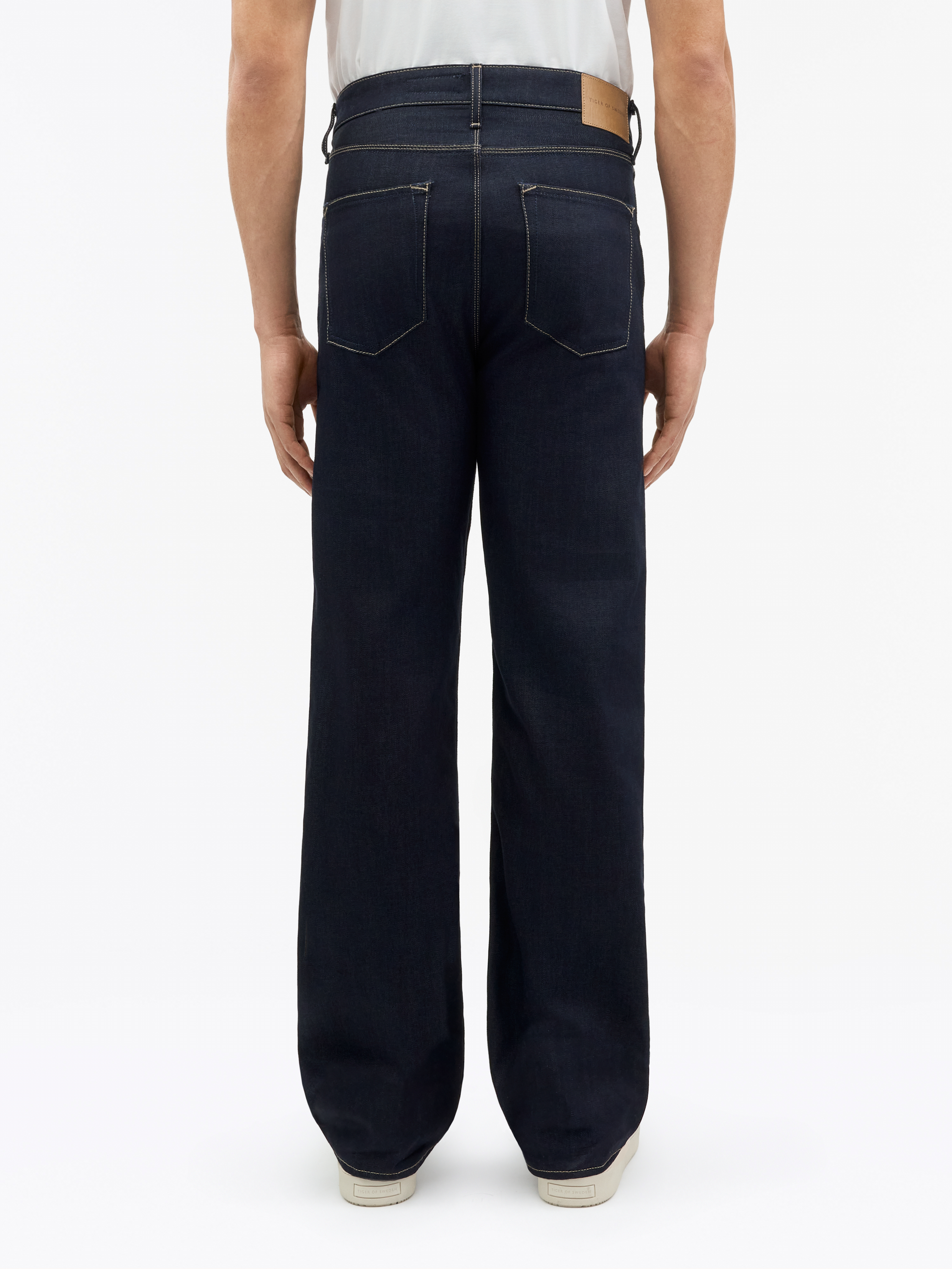 Man in dark blue Dash jeans