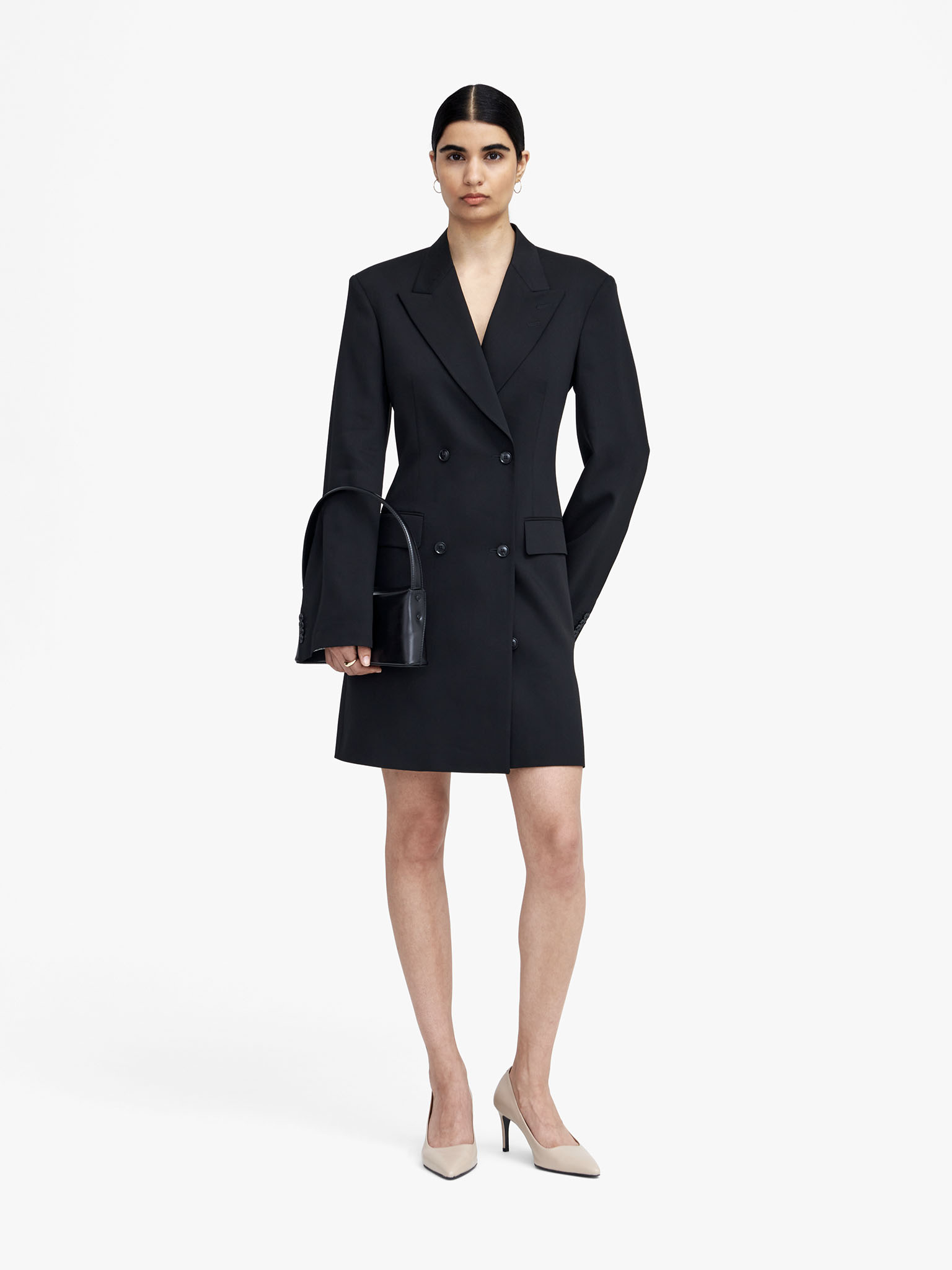 Woman in black blazer dress