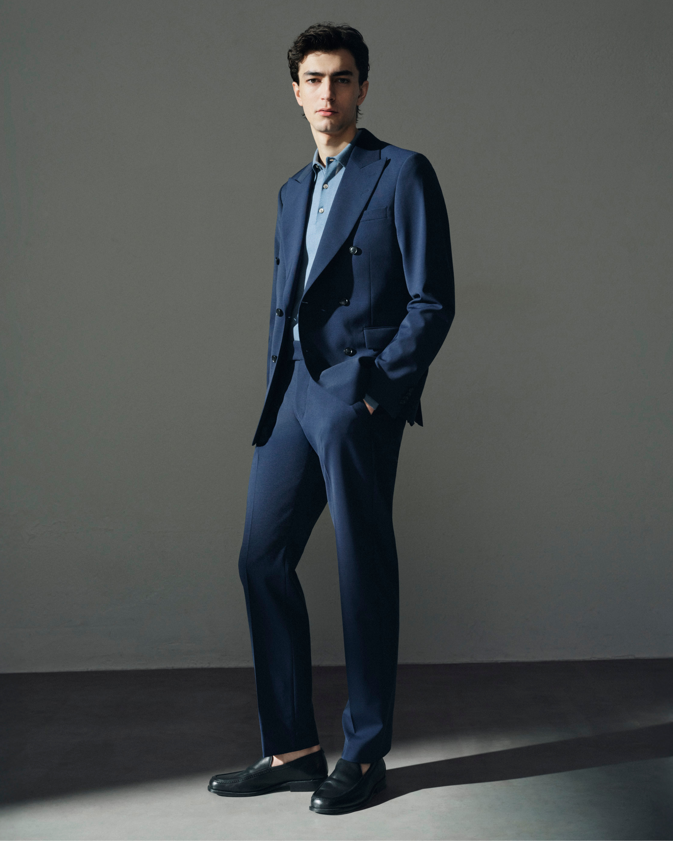 man in blue double breasted suit