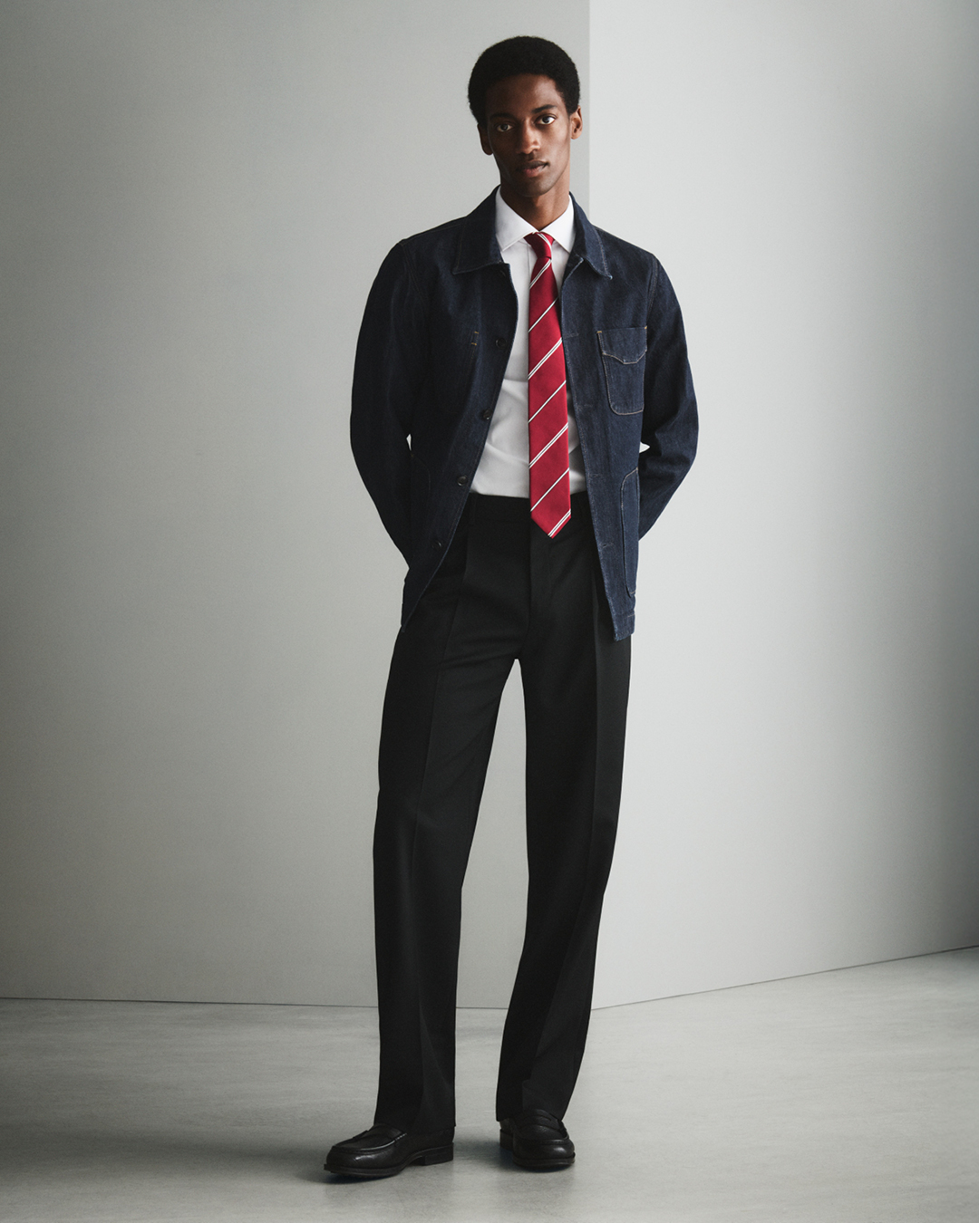 Man in trousers and blue denim jacket