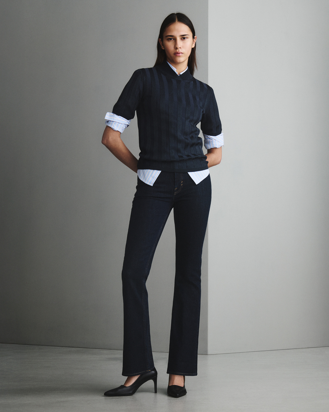 Woman in blue denim and knitwear