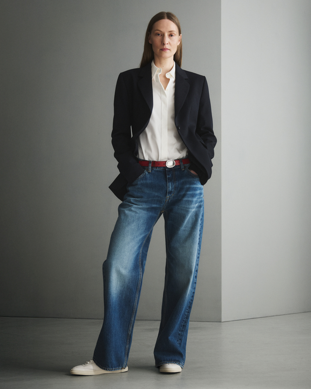 woman in dark blue denim and blazer