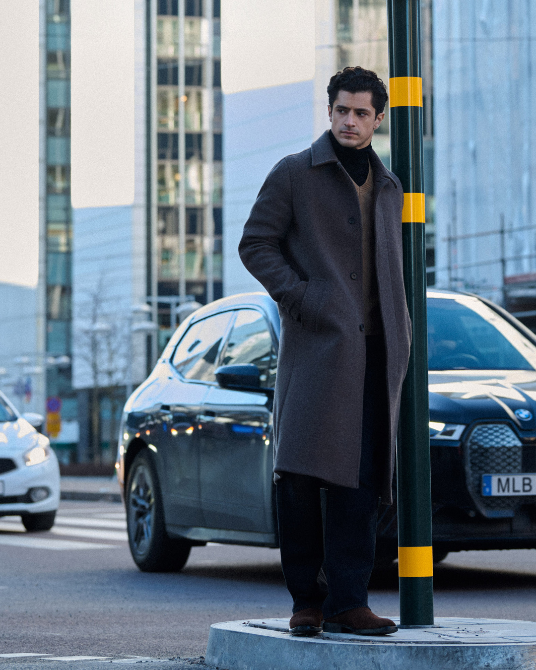man in coat and suit