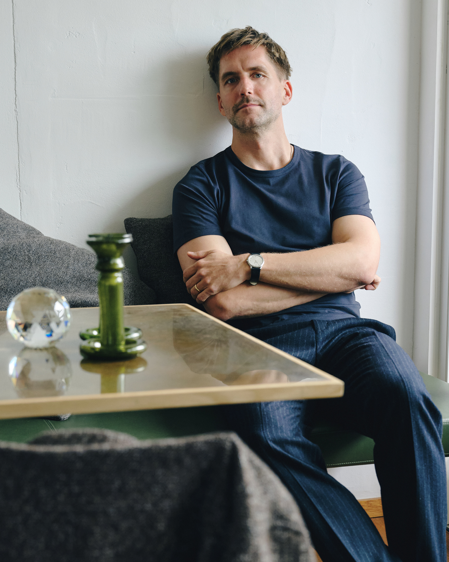 Sigurd Larsen in navy pinstriped trousers and navy t-shirt