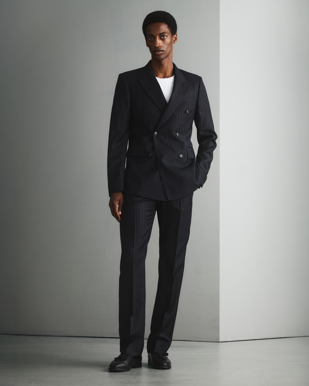 Man in double breasted black suit