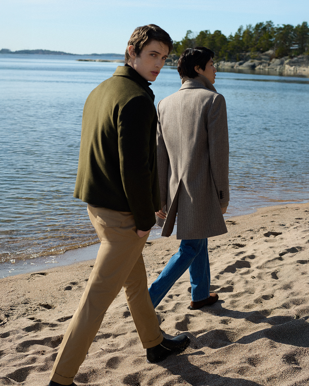 Men walking on beach