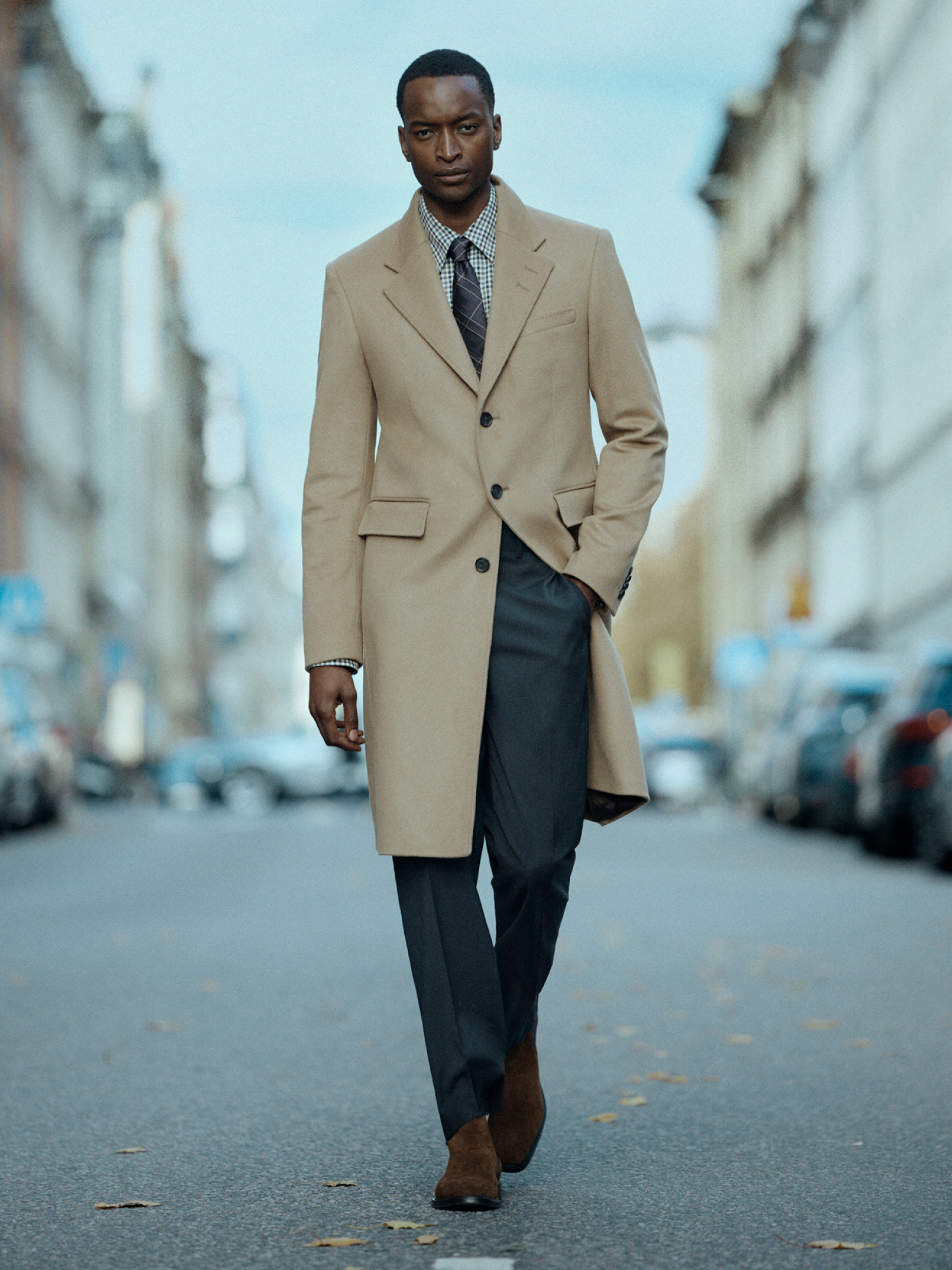 Man in beige long coat