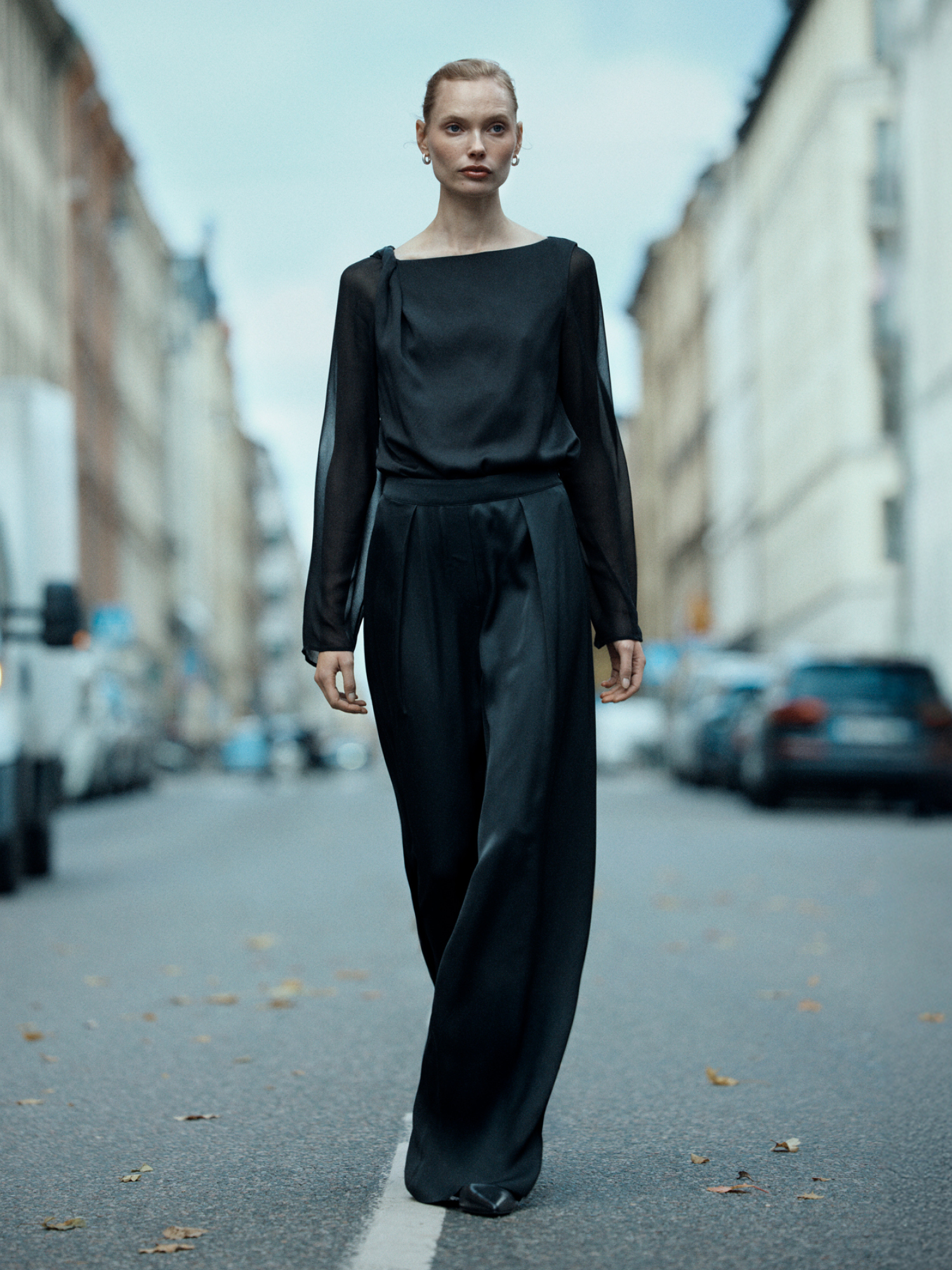 Woman in black satin set