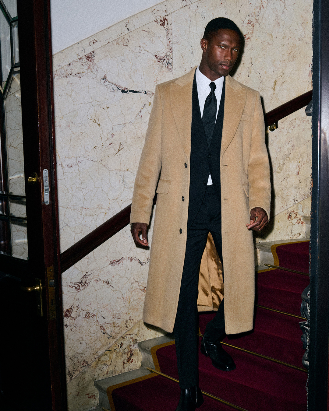 man in long beige coat