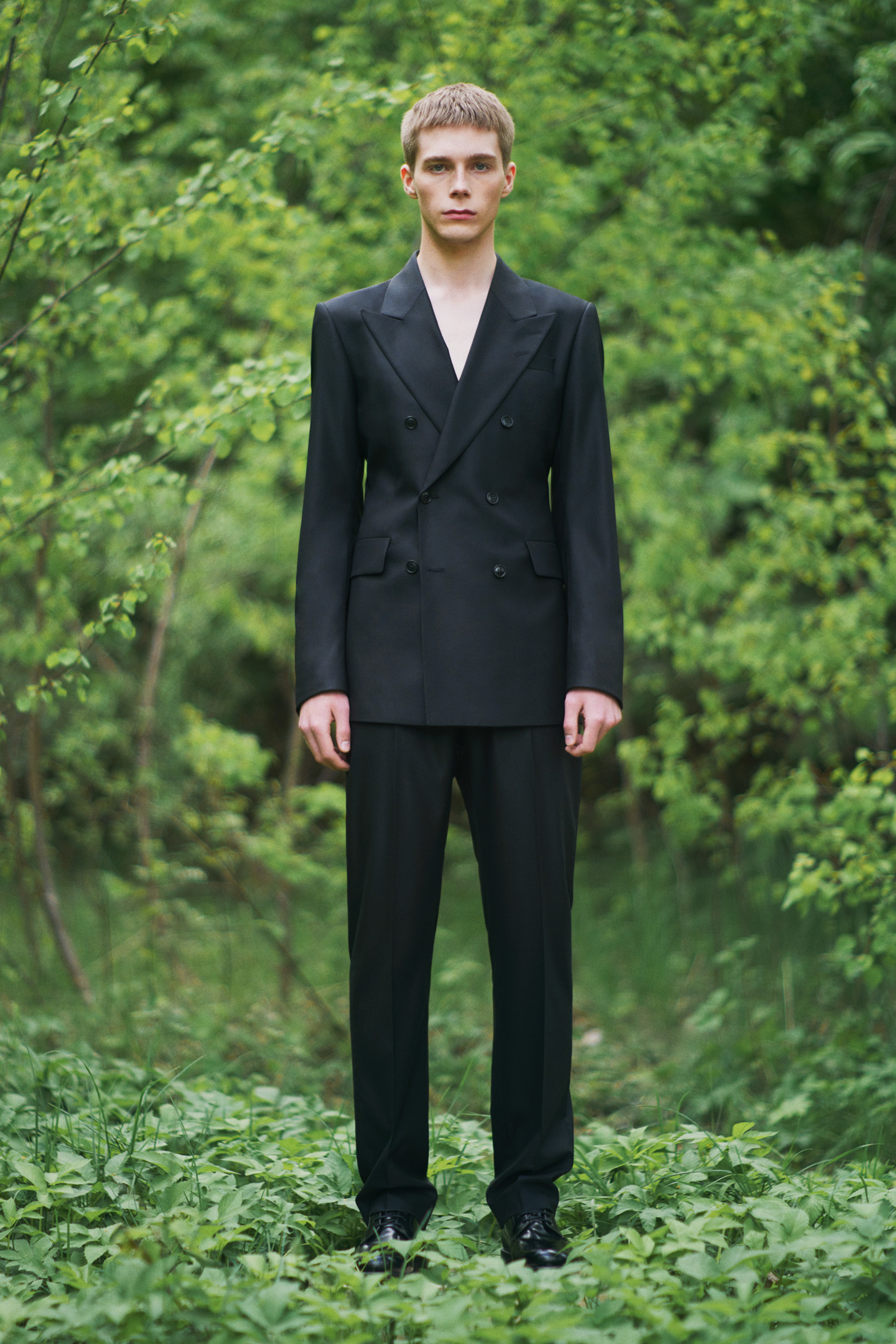 Man in styling Tiger of Sweden black suit