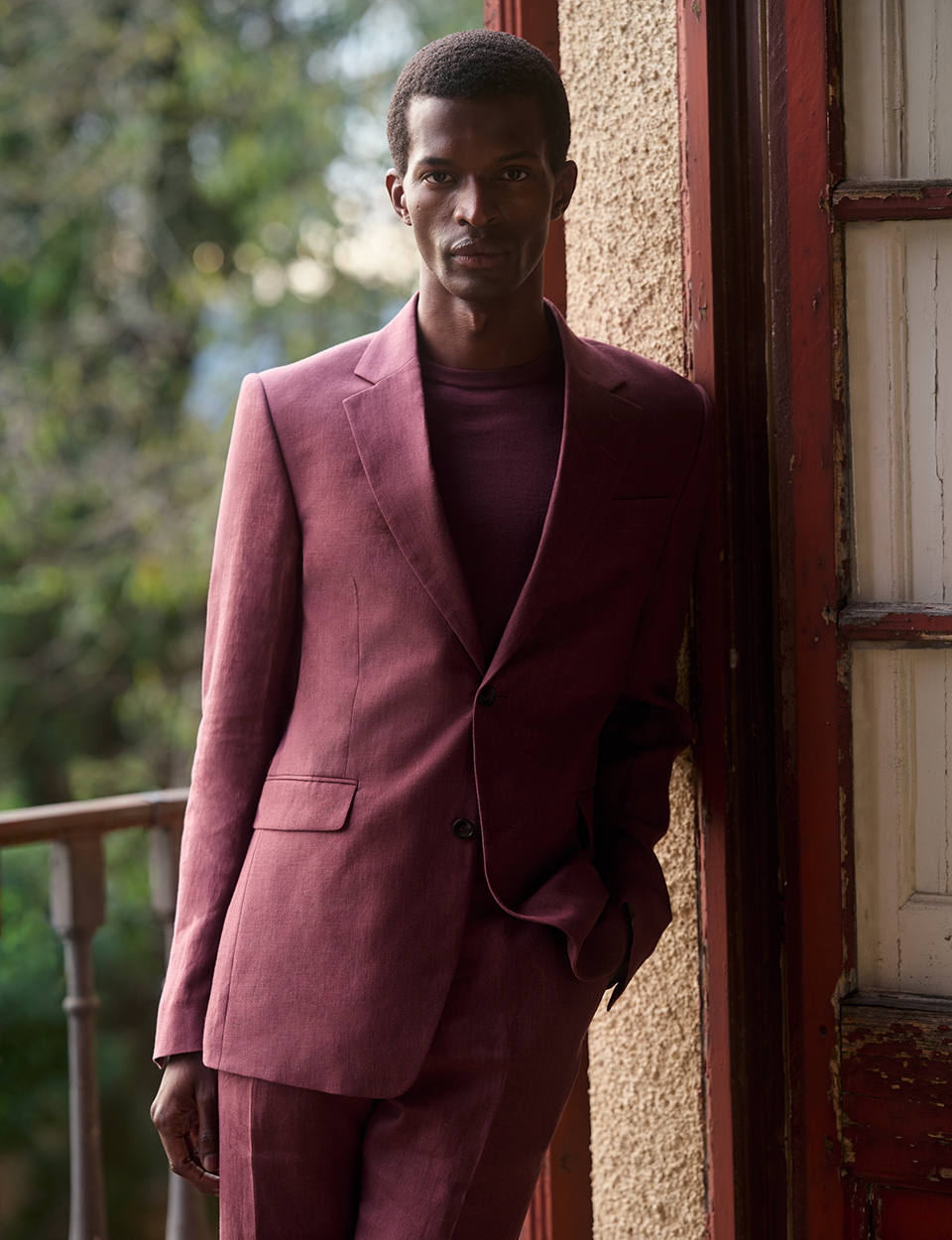 Man in dark red suit
