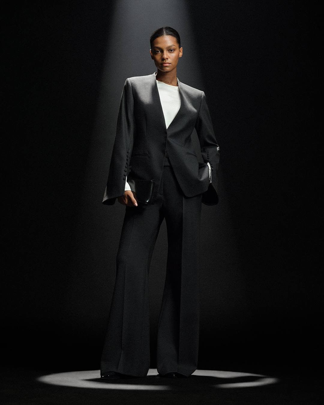 black festive suit with clutch