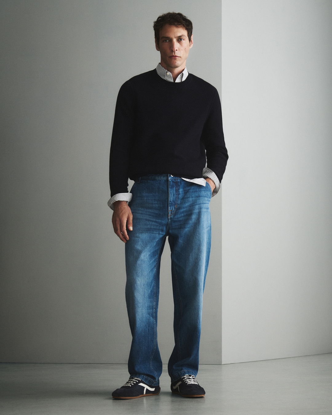 Man in blue denim and pullover