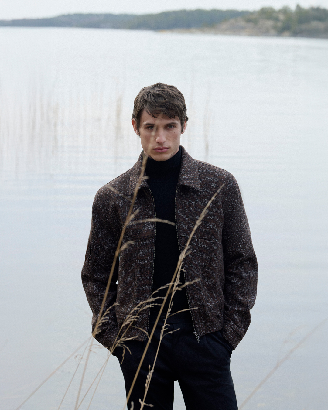man in dark grey bomber jacket