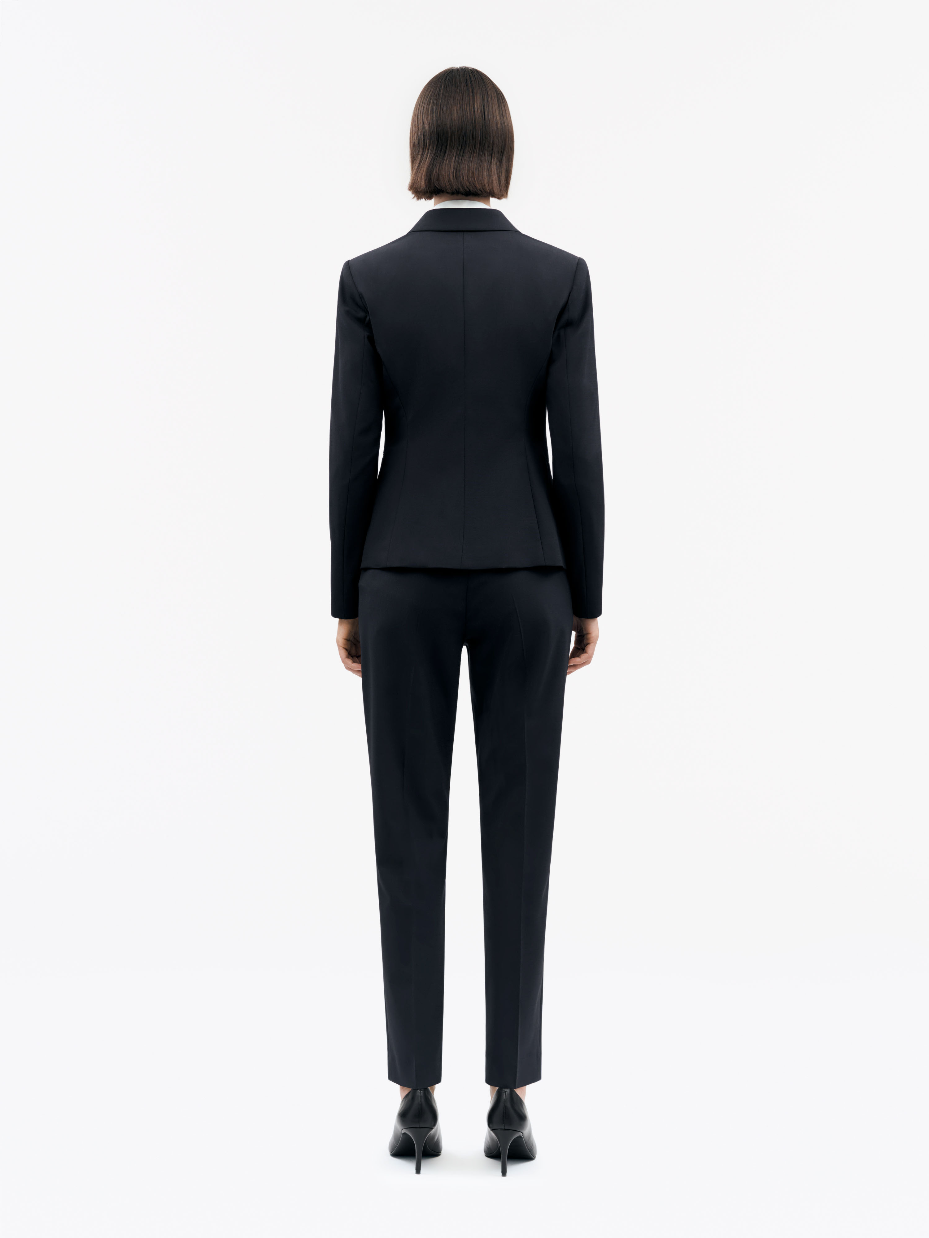 woman in navy blue mirja suit