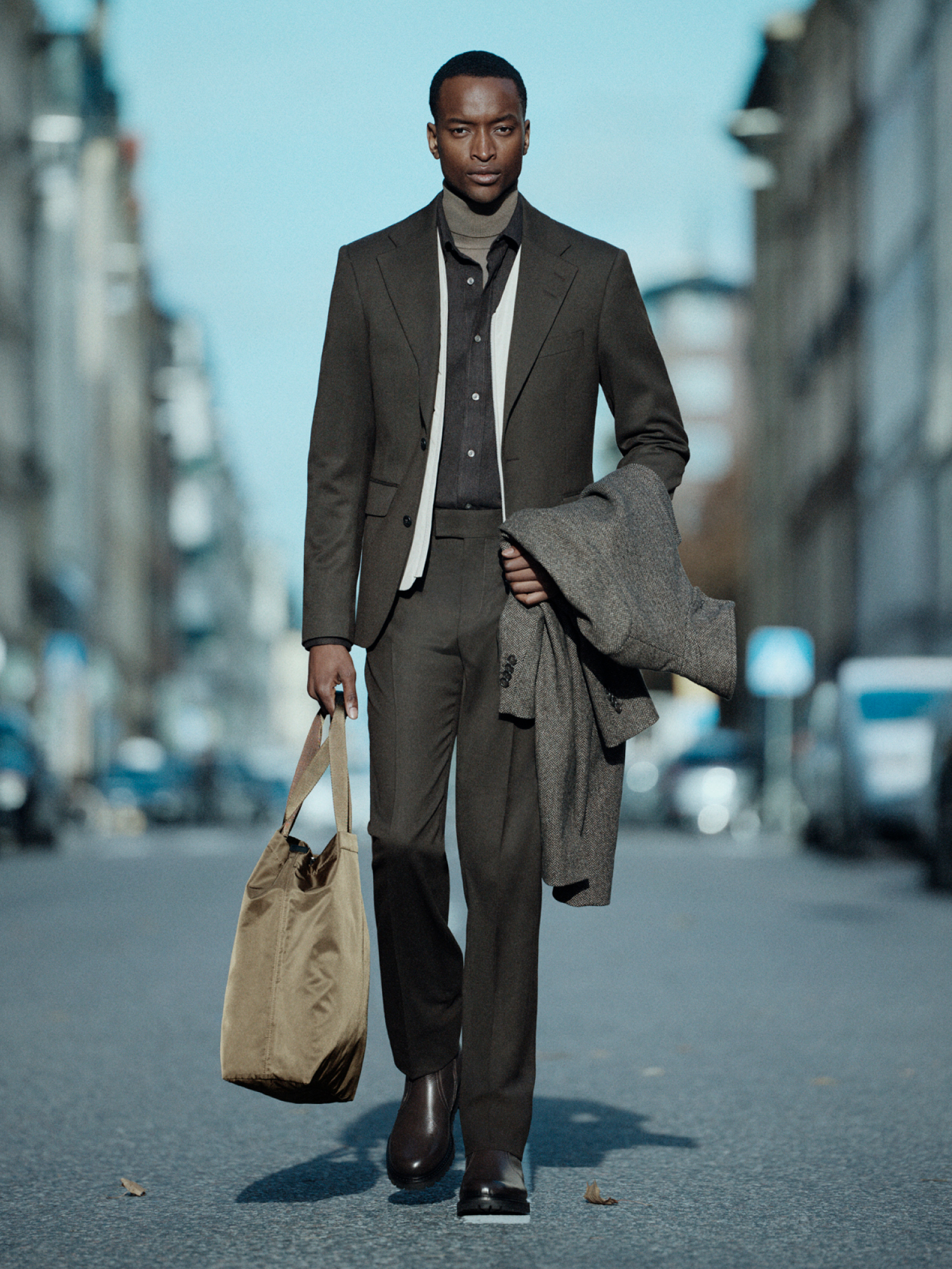 Man in brown layering outfit