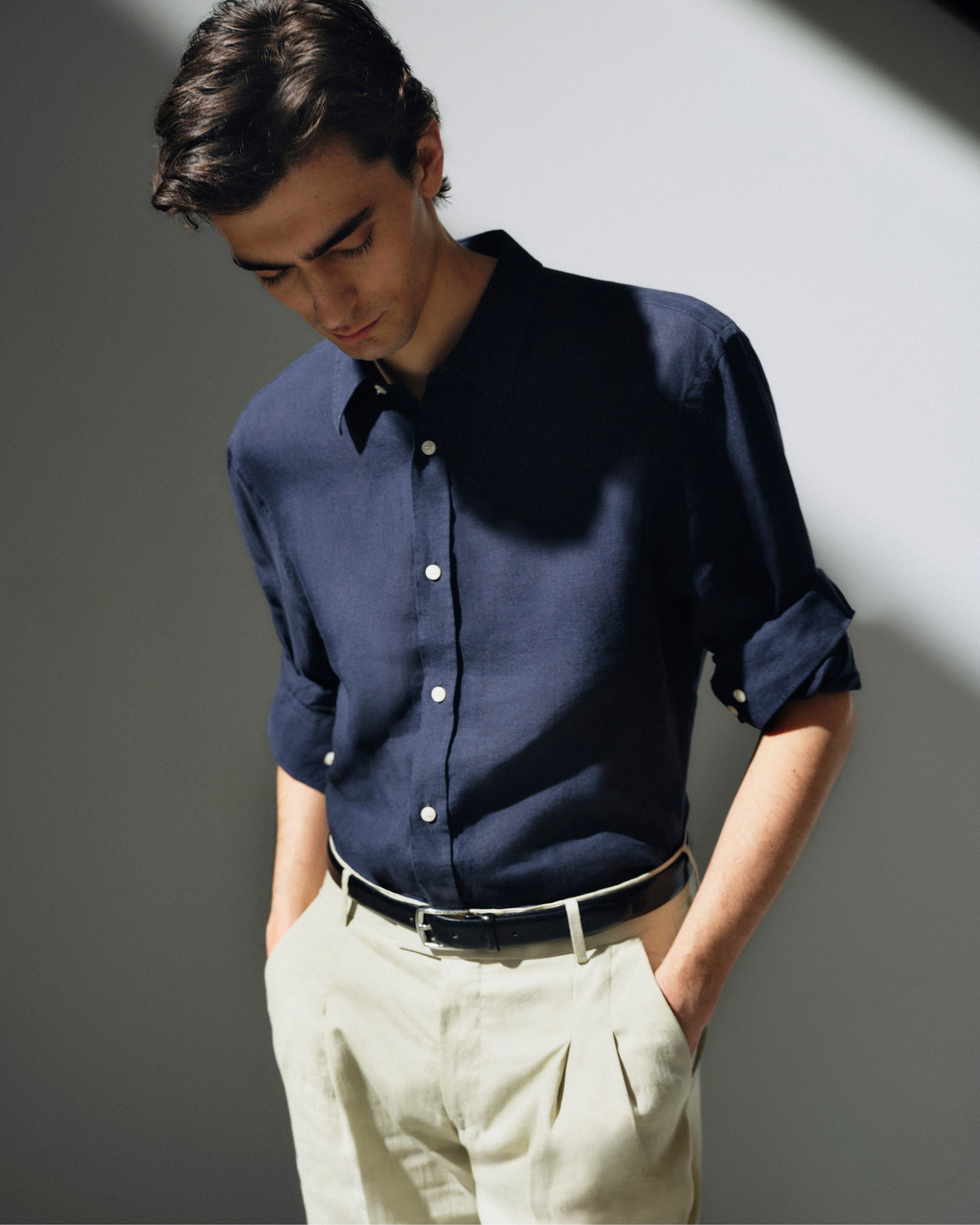 man in blue linen shirt & chinos