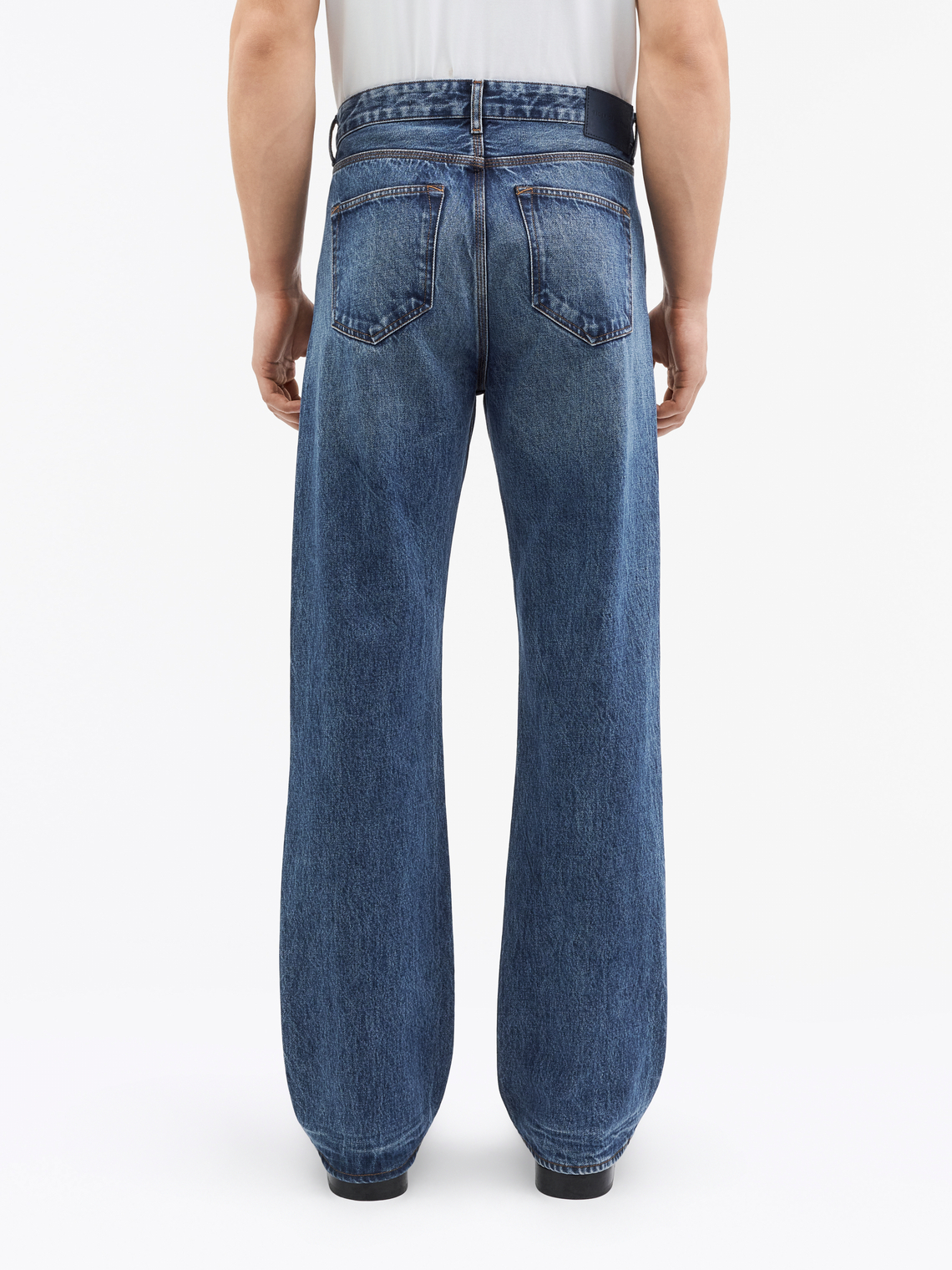 Man in dark blue Dash jeans