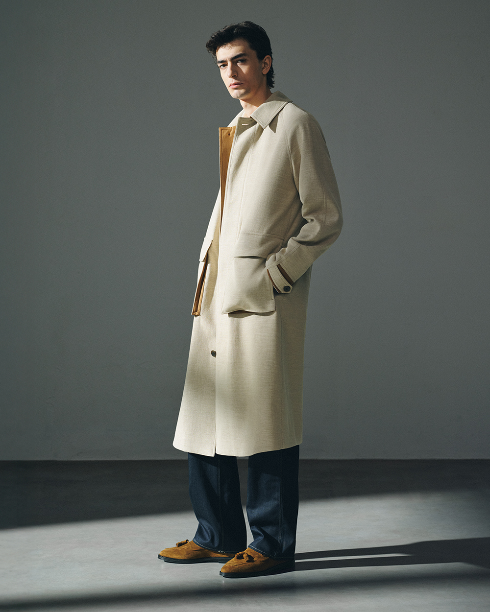 man in linen trenchcoat